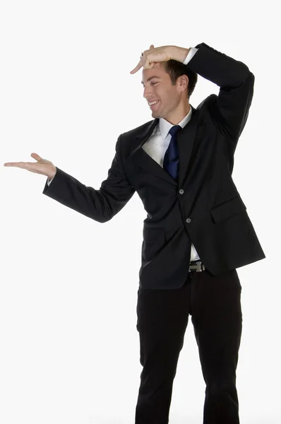 Affärsman som pekar mot hans palm — Stockfoto