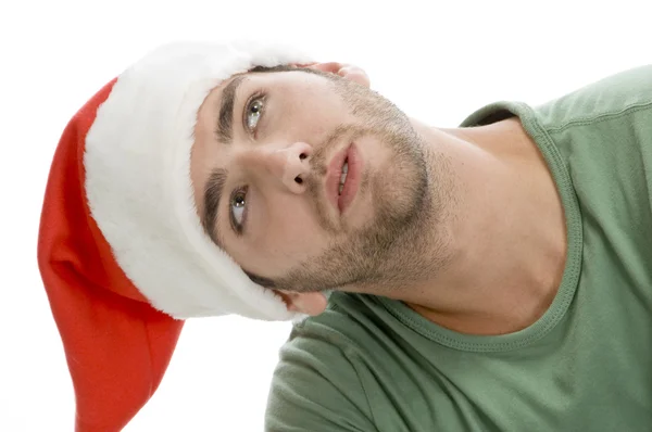 Man with santa cap looking upwards — Stock Photo, Image