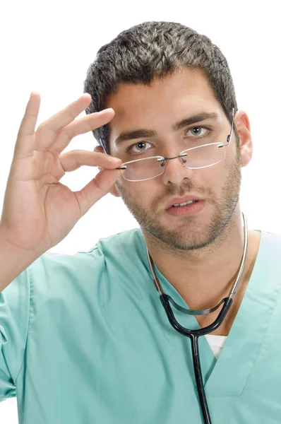 Doktor holding gözlükler — Stok fotoğraf