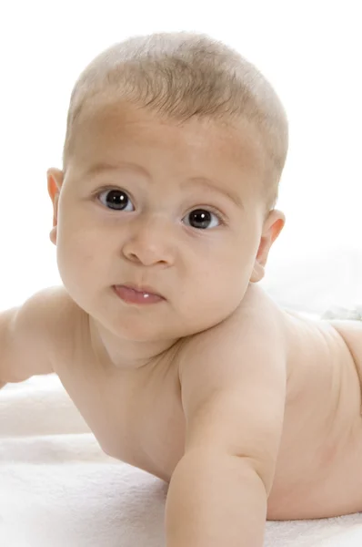 Child lying and looking at camera — Stock Photo, Image