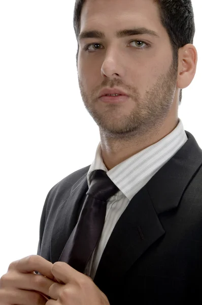 Businessman holding his tie — Stock Photo, Image