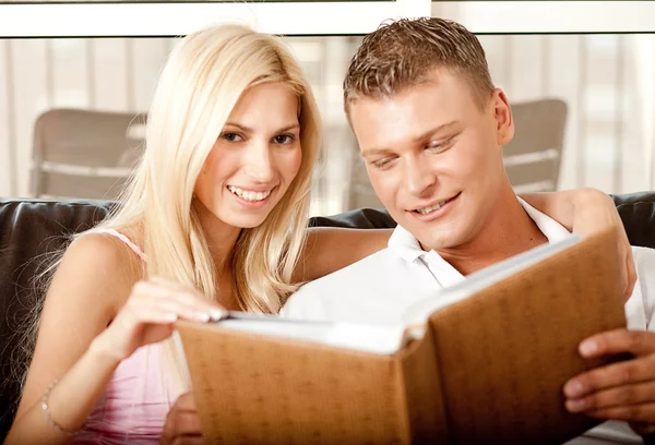 Couple going over album together Stockfoto