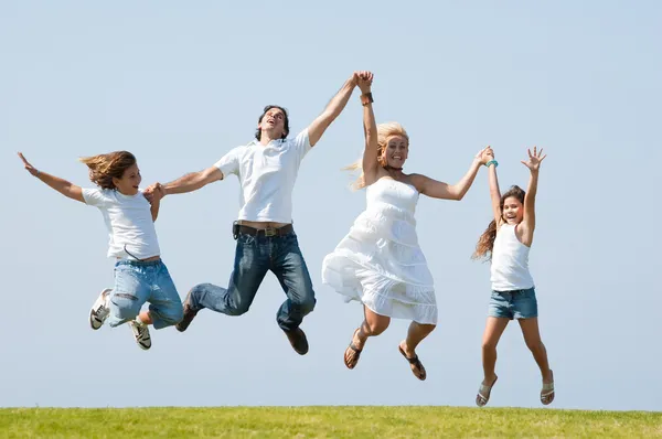 Happy family jumping high Stock Picture