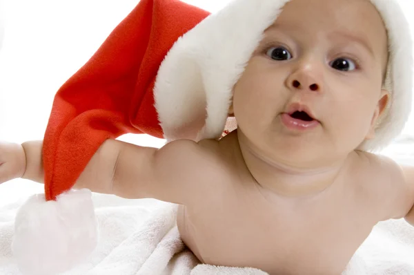 Cute young baby wearing santa cap Stock Photo