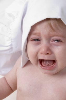 Portrait of crying little baby clipart