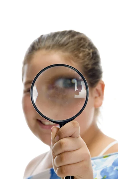 Girl looking through magnifier — Stock Photo, Image