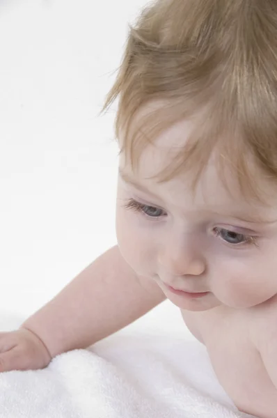 Cute small baby looking down — Stock Photo, Image