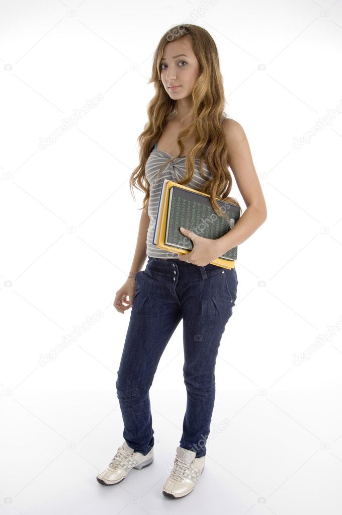 Teen girl holding school books, posing