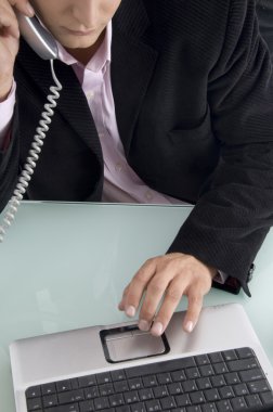 Close up of man working on laptop clipart