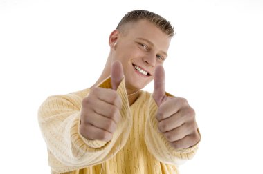 Handsome man showing good luck sign clipart