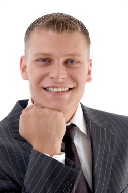 Pleased businessman smiling at camera clipart