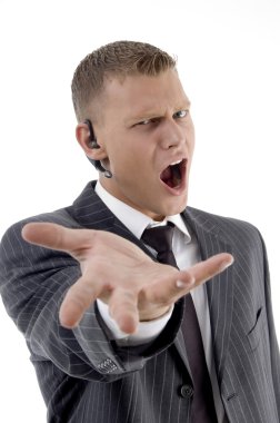 Angry young business male shouting clipart