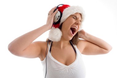 Young woman enjoying loud music clipart