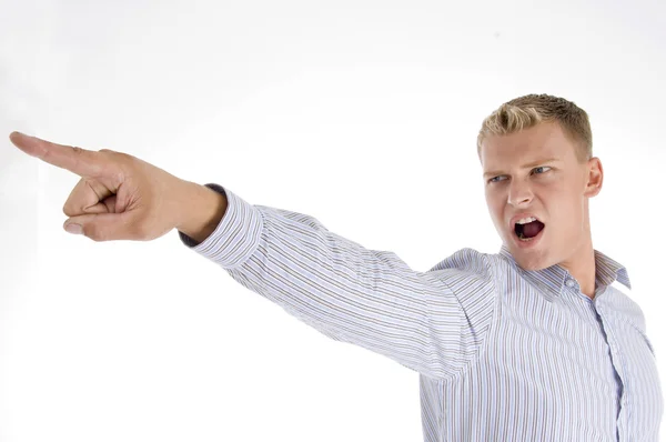 Caucasian man pointing and shouting — Stock Photo, Image