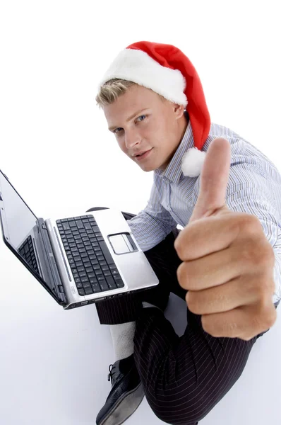 Young man working on laptop wishing luck — Stock Photo, Image