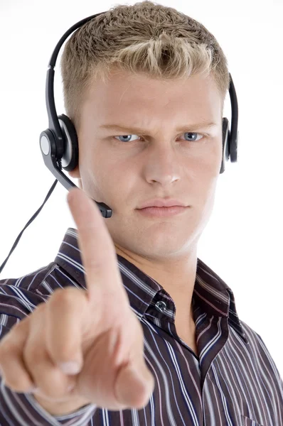 Homem com fone de ouvido mostrando dedo indicador — Fotografia de Stock