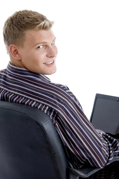 Smart guy with laptop looking at camera — Stock Photo, Image