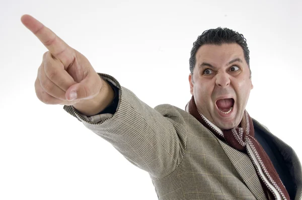 Shouting man pointing sideways — Stock Photo, Image
