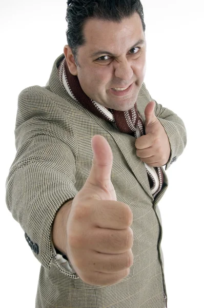 Человек показывает большие пальцы вверх жестом в гневе — стоковое фото