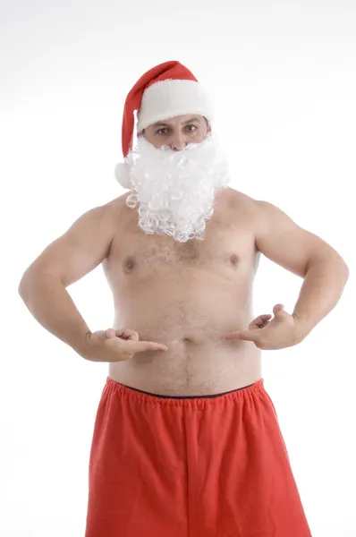 Śnięty Mikołaj wskazując jego żołądek — Zdjęcie stockowe
