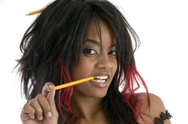 Portrait of girl with pencil in mouth — Stock Photo, Image