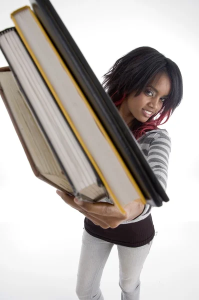 Hermosa joven estudiante sosteniendo sus libros — Foto de Stock
