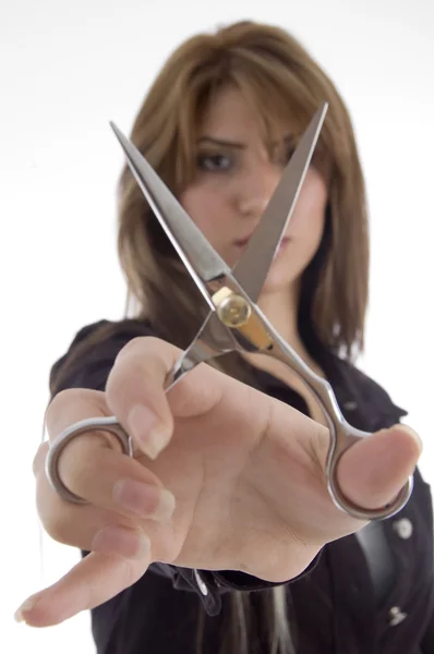 Female showing scissor to camera — Stock Photo, Image