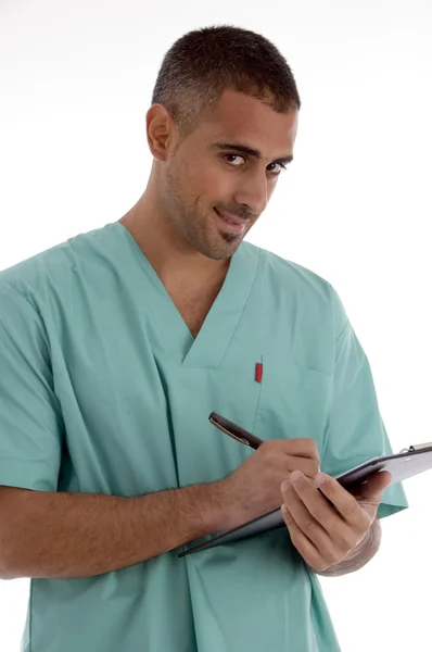 Médico escrevendo no bloco de notas — Fotografia de Stock
