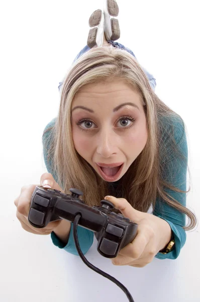 Surprised woman holding remote control — Stock Photo, Image