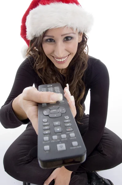 Femme souriante avec télécommande — Photo
