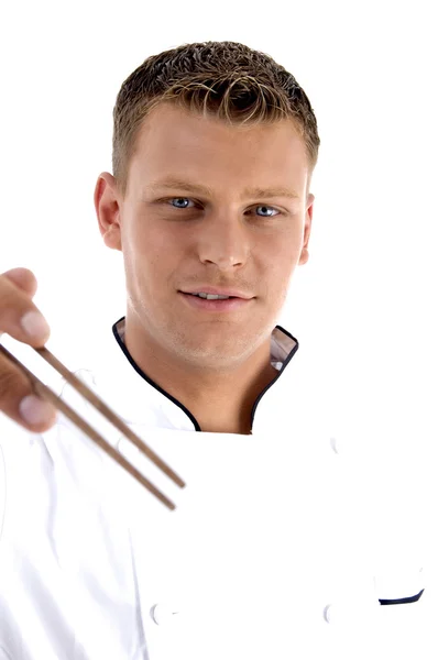 Hezký šéfkuchař hospodářství hůlky — Stock fotografie
