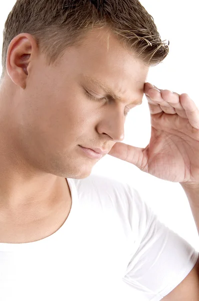 Mladý muž trpí bolestí hlavy — Stock fotografie