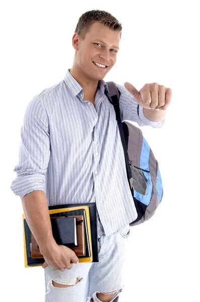 Estudante universitário com livros e mochila — Fotografia de Stock