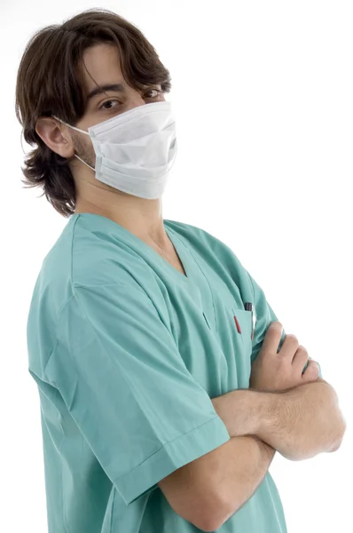 Médico en matorrales y máscara facial posando — Foto de Stock