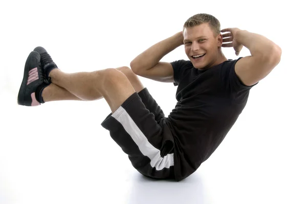 Young fit male doing crunches — Stock Photo, Image