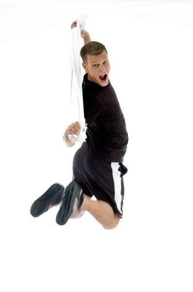 Jumping healthy man holding towel — Stock Photo, Image