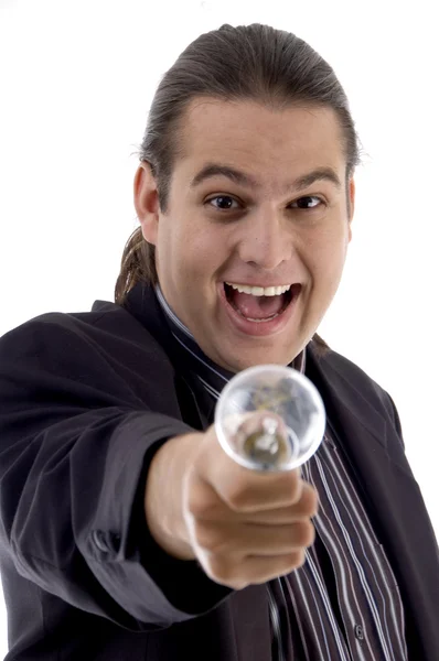 Happy executive showing electric bulb — Stock Photo, Image
