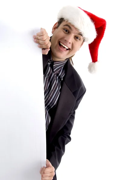 Executivo no chapéu de Natal espreitando — Fotografia de Stock
