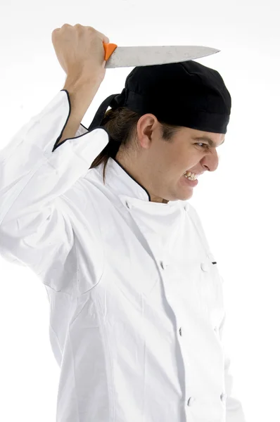 Rozhněván mužské šéfkuchař pózuje s nožem — Stock fotografie