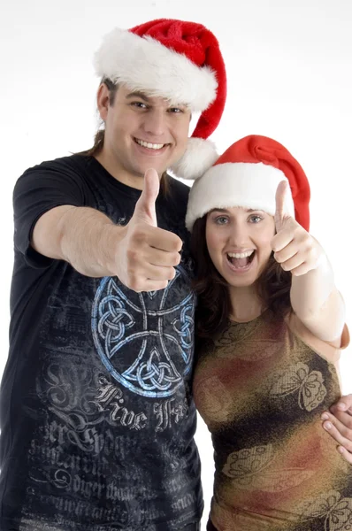 Feliz jovem casal vestindo chapéu de Natal — Fotografia de Stock