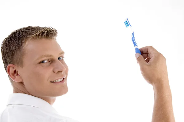 Adulto caucasiano segurando escova de dentes — Fotografia de Stock