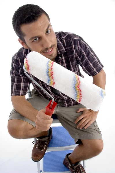 Close up view of man holding roller — Stock Photo, Image