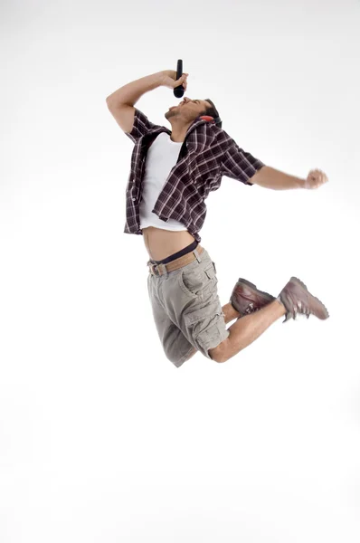 Young singer jumping high in air — Stock Photo, Image