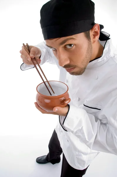 Mężczyzna kucharz z pałeczkami i miski — Zdjęcie stockowe