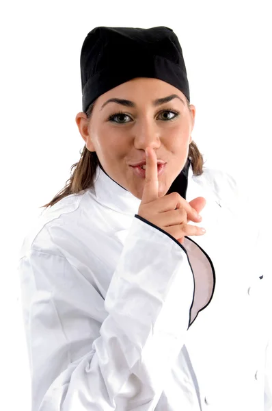 Kobieta kucharz pouczając zachować milczenie — Zdjęcie stockowe