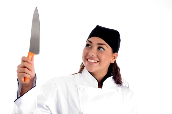 Uśmiechnięta kobieta kucharz z nożem — Zdjęcie stockowe
