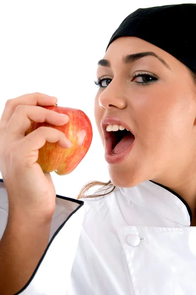 Primer plano de chef va a comer una manzana — Foto de Stock