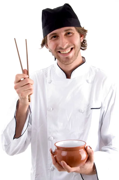Happy chef holding bowl and chopsticks — Stock Photo, Image