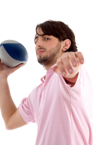 Side pose of man throwing rugby ball — Stock Photo, Image