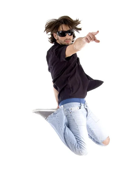Jumping handsome man pointing — Stock Photo, Image